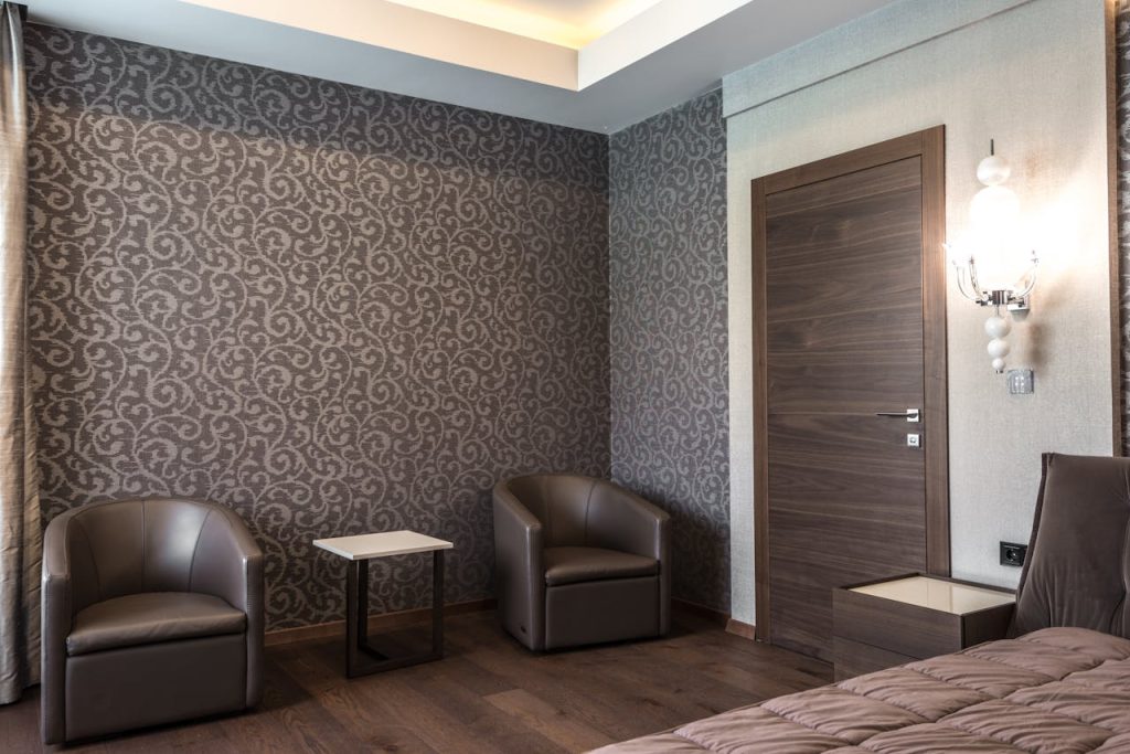 Luxurious hotel room featuring modern furniture and stylish decor.
